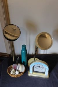 lot 36 image: Magnifying Mirrors, Room Spray, night lights, and a clock