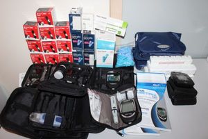 lot 47 image: Multiple Diabetic Testers, Testing Strps, lancets, Pill organizers and more