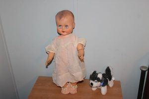 lot 49 image: Vintage doll and stuffed dog