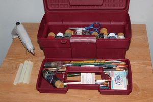 lot 56 image: Paints, brushes and hot glue gun