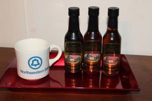 lot 115 image: Flavored syrup and coffee cup