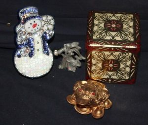 lot 154 image: Snowman Gift Box, Red Metal Square Gift Box, gold Tone Frog with Simulated Ruby Colored eyes  & Wizard Pencil Sharpener