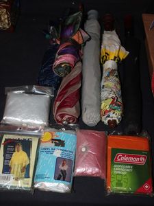 lot 155 image: Rain Gear, Several Ponchos, Umbrellas and Rain Caps