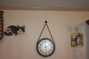 lot 192 image: Clock and Cat Wall Decor
