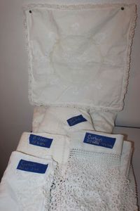 lot 214 image: Variety Of White Linens, Pillow Sham, Approx 26in,  Approx 80 Round Table Cloth, doylies, Curtains 22 with 46 Long