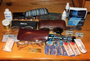 lot 229 image: Glasses, Cases, repair kits, lens cleaner