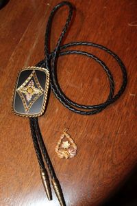 lot 251 image: Gorgeous Vintage Real Black Hills Gold Bolo Tie, Matte Black Enameled Bolo Slide Holds Tri Color Gold Leaf & Berry Decoration in Pink, Green and Yellow Gold Rectangular Shipe 2 18in and Vintage JCO 12 & 10K Black Hills Gold  Pendant