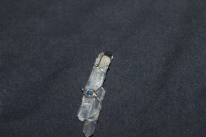 lot 339 image: Crystal Pendant Wrapped with 925 Wire with a Lapis Stone Center