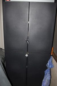 lot 379 image: Plastic Outdoor Storage Cabinet with Contents