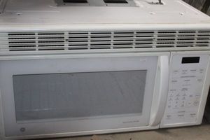 lot 16 image: General Electric Microwave Model JVM144WD002 Approx 30x14x13.5