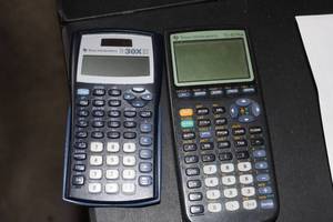 lot 135 image: Two Texas Instructment Calculators