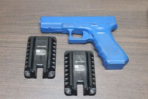 lot 187 image: Blue Trainine Prop Gun and Two Quick draw Magnetic Gun Mounts
