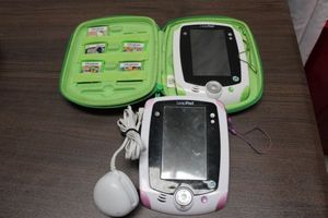 lot 188 image: Two Leep Pads, 1 Case and Five Games
