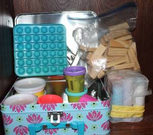 lot 289 image: Metal Kids Lunch box filled with Activities, Play-doh, Sidewalk Chalk and More