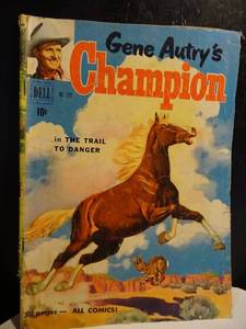 lot 244 image: $$ VINTAGE Gene Autrys Champion #319 VG Dell comic 1951 Trail to Danger