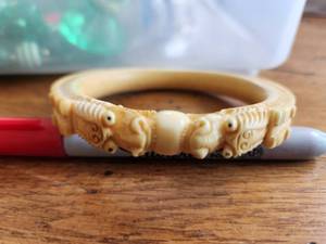 lot 4 image: Vintage dragon themed celluloid() bangle bracelet