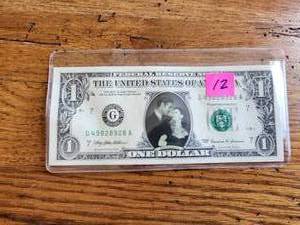 lot 52 image: Collectible dollar bill with Rhett and Scarlet from Gone with the Wind