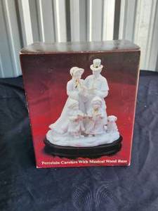 lot 44 image: Vintage porcelain Carolers with musical wood base in box