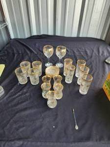 lot 75 image: Selection of carved glass in gold trim glassware