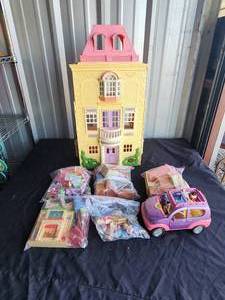 lot 64 image: Barbie house and lots of furniture and accessories