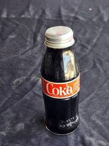 lot 211 image: Collectible full Coke bottle