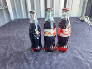 lot 219 image: Collectible full Coca Cola - Coke bottles