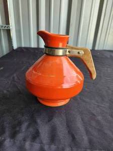 lot 238 image: Vintage orange pottery carafe