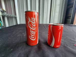 lot 256 image: Selection of 2 collectible full Coke, Coca Cola cans