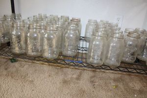 lot 14 image: Kerr and Ball canning jars plus square Mason jars