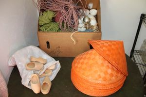 lot 16 image: Orange Samurai woven hats, wooden clogs, craft ribbons and macrame cords