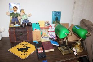 lot 71 image: Mixed assortment bankers lamps, talking dolls (Jeff Foxworthy and Larry the Cable Guy), books, storage chest, wood table kit