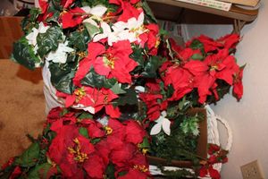 lot 99 image: Large white basket with artificial poinsettias