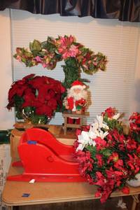 lot 103 image: Christmas decorations with Santa figurine and red wooden sleigh