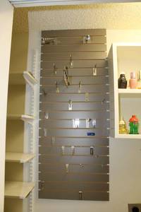 lot 154 image: Slat walls and hooks (bring tools to remove)