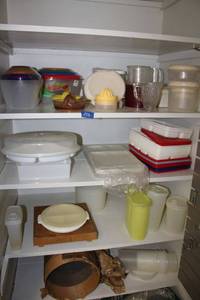 lot 156 image: Plastic storage containers, cutting block and vintage sifters and citrus juicers