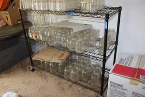 lot 31 image: Black wire shelf unit with locking wheels