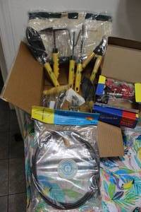 lot 52 image: Gardening tool set, drain snake tool, and  34 pipe clamp sets