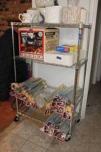 lot 54 image: Chrome wire shelfing unit with locking wheels