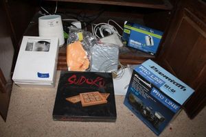 lot 203 image: Orbi router, Sudoku game, VHS and DVD players