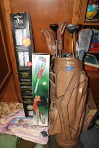 lot 254 image: Golf bag and clubs, and swing trainers