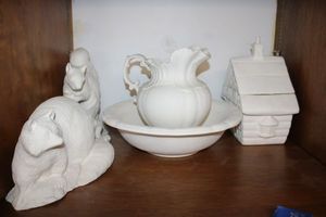lot 285 image: Unfinished ceramic Bisque cookie jar, pitcher and basin, animal figurines