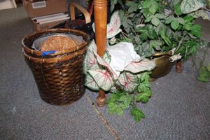 lot 297 image: Brass planter with greenery and baskets as shown