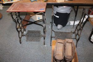 lot 304 image: Cast iron sewing machine bases with pair of wood drawers