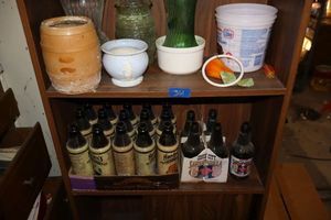 lot 361 image: Brown glass bottles and Misc. flower vases