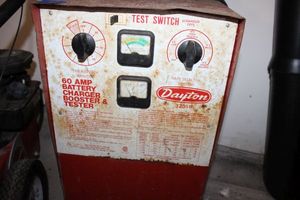 lot 412 image: Dayton 60 Amp battery charger booster and tester