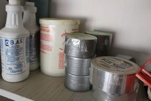 lot 428 image: Duct tape and cleaning bottles