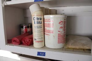 lot 429 image: Degreaser cans and red trash bags