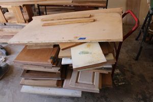 lot 467 image: Wood cabinet doorsshelves with red dolly