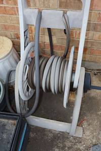lot 589 image: Garden reel with hose