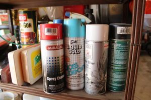 lot 503 image: Paint spray cans and tools